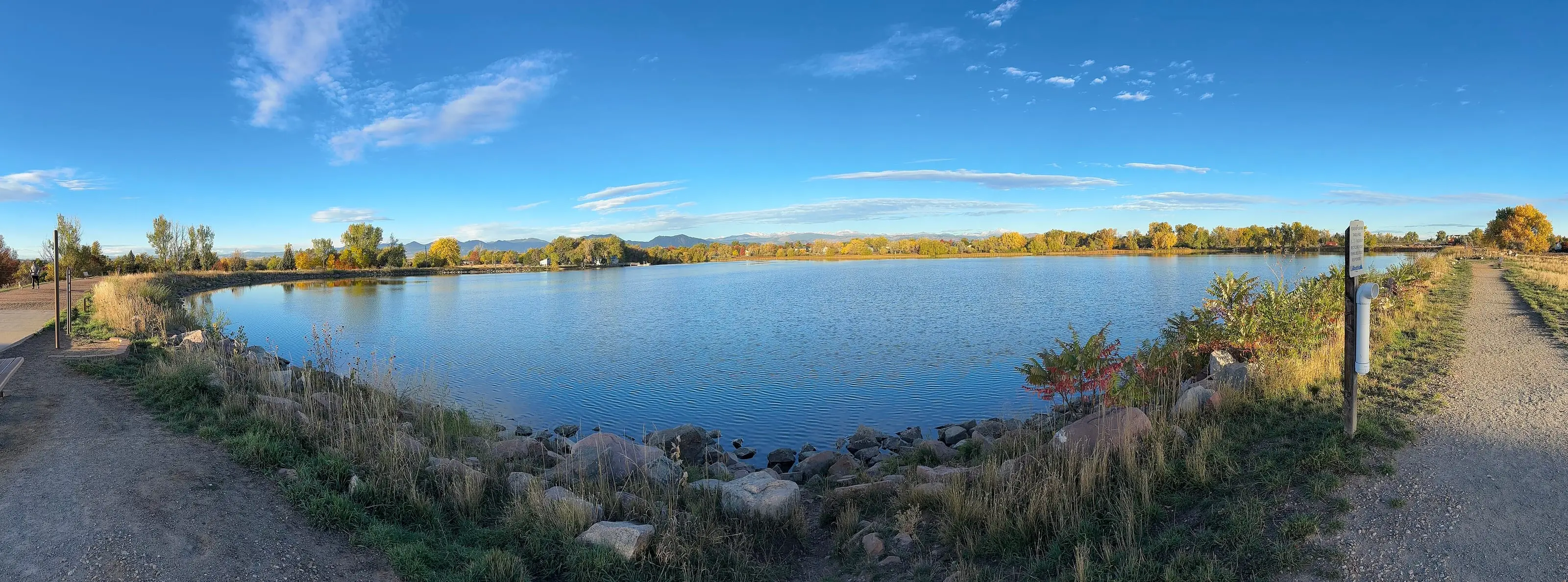 Waneka Lake in Lafayette on a clear autumn morning, with the Front Range low on the western horizon